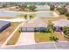 Beautiful home with a three-car garage and a scenic water view in the backyard at 829 Terranova Rd, Winter Haven, FL 33884