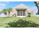 A lovely backyard featuring a screened-in porch and well-maintained lawn at 829 Terranova Rd, Winter Haven, FL 33884