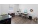Bonus room with hardwood floors and natural light creates a bright and inviting atmosphere at 829 Terranova Rd, Winter Haven, FL 33884