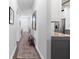 Home hallway with stylish flooring, wall decor, and access to the kitchen at 829 Terranova Rd, Winter Haven, FL 33884