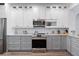Bright, modern kitchen featuring stainless steel appliances and granite countertops at 829 Terranova Rd, Winter Haven, FL 33884