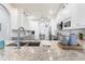 Kitchen featuring granite countertops, stainless steel sink, and white cabinets with an archway leading to the dining room at 829 Terranova Rd, Winter Haven, FL 33884