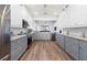 Modern kitchen featuring stainless steel appliances, granite countertops, and ample cabinet space at 829 Terranova Rd, Winter Haven, FL 33884