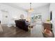 Bright living room featuring an arched entryway, ceiling fan, and sliding glass doors at 829 Terranova Rd, Winter Haven, FL 33884