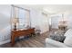 Inviting living room with hardwood floors, a large window, and stylish furniture at 829 Terranova Rd, Winter Haven, FL 33884