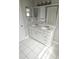 Bright bathroom with double sink vanity, ample storage, and modern fixtures at 8347 Willowwood St, Orlando, FL 32818
