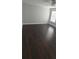 Bright bedroom featuring dark wood flooring and a ceiling fan at 8347 Willowwood St, Orlando, FL 32818