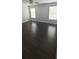 Spacious bedroom with dark wood flooring and great natural light at 8347 Willowwood St, Orlando, FL 32818
