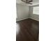 Cozy bedroom featuring dark wood flooring, ceiling fan, and plenty of natural light at 8347 Willowwood St, Orlando, FL 32818