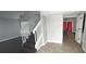 Hallway with staircase, hardwood floors, and natural light at 8347 Willowwood St, Orlando, FL 32818
