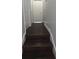 Hallway featuring stairs and wood floors at 8347 Willowwood St, Orlando, FL 32818