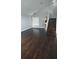 Bright living room with staircase, hard surface floors, and large window at 8347 Willowwood St, Orlando, FL 32818