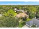 Bird's eye view of the home surrounded by lush tropical landscaping and a long walkway at 8740 Ingleton Ct, Orlando, FL 32836