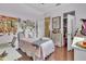 Cozy bedroom with hardwood floors, desk and closet to add your personal touch at 8740 Ingleton Ct, Orlando, FL 32836