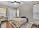 This bedroom features hardwood floors, neutral paint, and built in closet at 8740 Ingleton Ct, Orlando, FL 32836