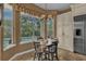 Cozy breakfast nook with large windows offering pool views and plenty of natural light at 8740 Ingleton Ct, Orlando, FL 32836