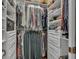 Walk-in closet featuring organized shelving and drawers at 8740 Ingleton Ct, Orlando, FL 32836