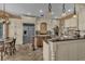 Spacious kitchen with white cabinets, granite countertops, stainless steel appliances, and a breakfast nook at 8740 Ingleton Ct, Orlando, FL 32836