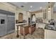 Modern kitchen with white cabinetry, stainless steel appliances, granite countertops, and a center island at 8740 Ingleton Ct, Orlando, FL 32836