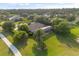 Aerial view of the home showing landscaping and the screened-in pool at 1091 Hampstead Ln, Ormond Beach, FL 32174