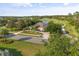 Aerial view of the home showing landscaping, proximity to golf course and lake at 1091 Hampstead Ln, Ormond Beach, FL 32174