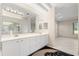 Bright bathroom features dual sinks, vanity, and ample natural light at 1091 Hampstead Ln, Ormond Beach, FL 32174