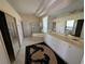 Bathroom with dual sinks, soaking tub, and a separate glass-enclosed shower at 1091 Hampstead Ln, Ormond Beach, FL 32174