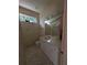 Bathroom with white vanity, marble countertop, and decorative lighting fixtures at 1091 Hampstead Ln, Ormond Beach, FL 32174