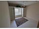 Spacious room with custom built-ins, bright window, and a stylish rug at 1091 Hampstead Ln, Ormond Beach, FL 32174