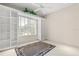 The bedroom includes built-in bookshelves, blinds, and tile flooring at 1091 Hampstead Ln, Ormond Beach, FL 32174