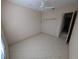 Well-lit bedroom with neutral paint, tile floors and a closet at 1091 Hampstead Ln, Ormond Beach, FL 32174