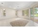 Spacious bedroom features tile floors, ceiling fan, and natural lighting at 1091 Hampstead Ln, Ormond Beach, FL 32174