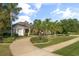 Beautiful home with lush landscaping, curved driveway and verdant, well-maintained lawn at 1091 Hampstead Ln, Ormond Beach, FL 32174