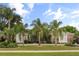 Charming single-story home with a well-manicured lawn and mature palm trees at 1091 Hampstead Ln, Ormond Beach, FL 32174