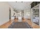 View of the open kitchen and living area, with a central island and access to the sunroom at 1091 Hampstead Ln, Ormond Beach, FL 32174