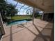 Spacious screened-in lanai with a pool, pond and golf course views at 1091 Hampstead Ln, Ormond Beach, FL 32174
