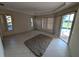 Spacious living room with tile flooring and sliding glass doors to the outdoor patio at 1091 Hampstead Ln, Ormond Beach, FL 32174