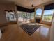 Bright living room with hardwood floors, fireplace, golf course views, and access to the screened-in lanai at 1091 Hampstead Ln, Ormond Beach, FL 32174