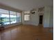 Open floor plan living room area with natural light and pool view at 1091 Hampstead Ln, Ormond Beach, FL 32174