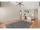 Open-concept living room featuring hardwood floors and access to the kitchen with island at 1091 Hampstead Ln, Ormond Beach, FL 32174