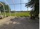 Covered patio and outdoor space perfect for enjoying serene views of the pond and golf course at 1091 Hampstead Ln, Ormond Beach, FL 32174