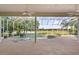 Beautiful covered pool and jacuzzi with waterfall feature and relaxing view of golf course and lake at 1091 Hampstead Ln, Ormond Beach, FL 32174
