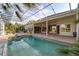 Beautiful covered pool and jacuzzi with view of the yard at 1091 Hampstead Ln, Ormond Beach, FL 32174