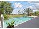 Beautiful screened-in pool and spa with outdoor seating offer a relaxing view of the lawn at 1091 Hampstead Ln, Ormond Beach, FL 32174