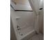 Close-up of a bathtub with shower, featuring a white tile surround with a black accent stripe at 1091 Hampstead Ln, Ormond Beach, FL 32174