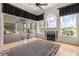 Bright sunroom with fireplace, large windows, and a view of the pool and screened-in lanai at 1091 Hampstead Ln, Ormond Beach, FL 32174