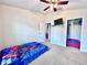 Bedroom with closet and view to bathroom at 1171 Legatto Loop, Dundee, FL 33838