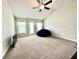 Spacious living room featuring neutral carpet and a backyard view at 1171 Legatto Loop, Dundee, FL 33838