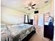 Serene main bedroom with vaulted ceiling, cozy carpet, and lots of natural light at 1171 Legatto Loop, Dundee, FL 33838