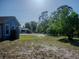 Spacious backyard with lush greenery, offering plenty of room for outdoor activities at 15 Estrella Rd, Debary, FL 32713